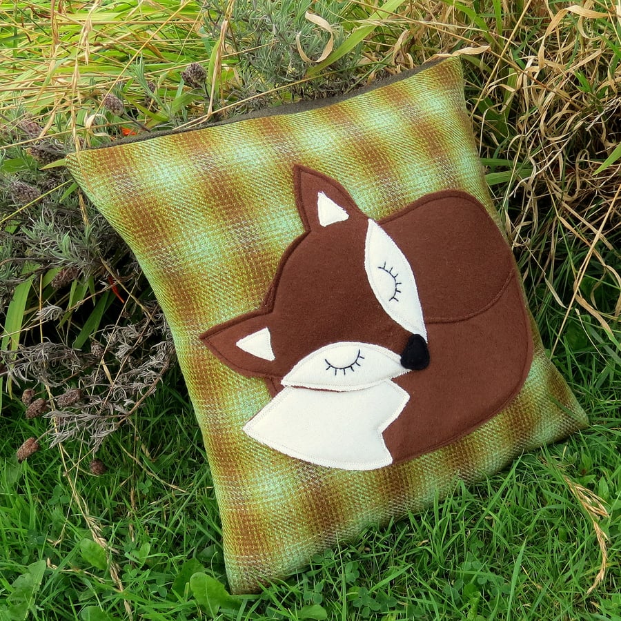 Little brown fox.  A fox cushion on tactile wool.  Complete with feather pad.