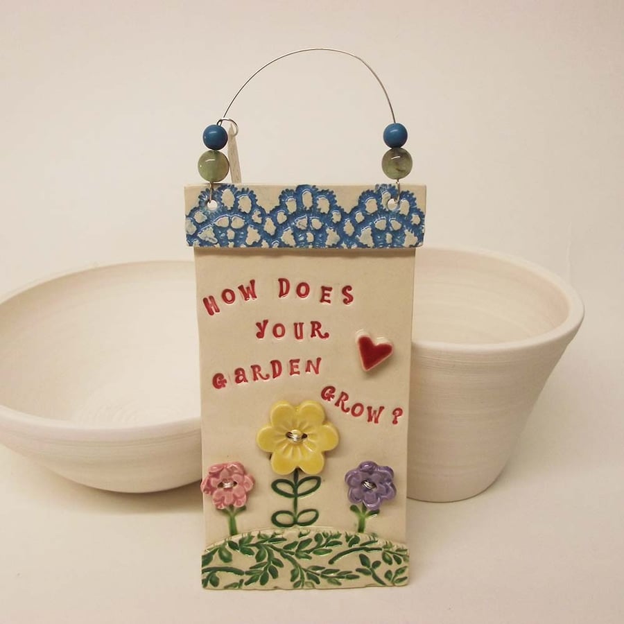 Ceramic How Does Your Garden grow wall plaque Pottery