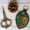 Embroidered up cycled leaf keyring or bag charm.