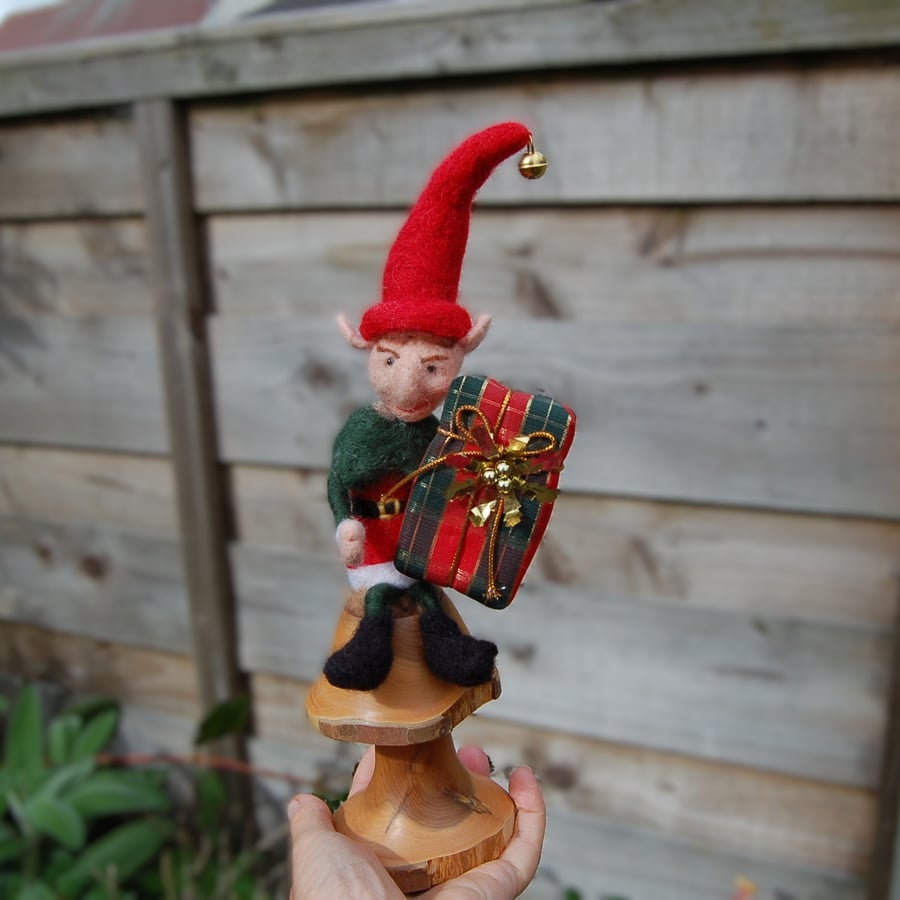 Christmas elf sat on a mushroom. Upcycled wood mushroom. 30 cm in height