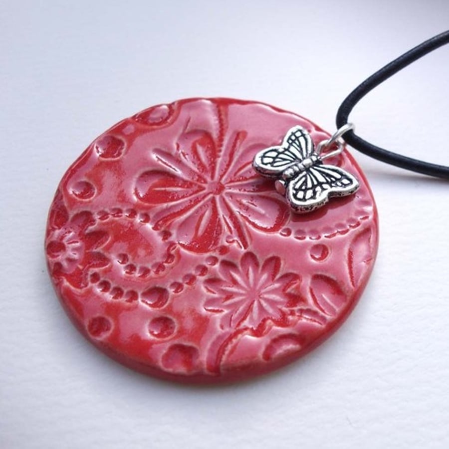 Red ceramic pendant with butterfly
