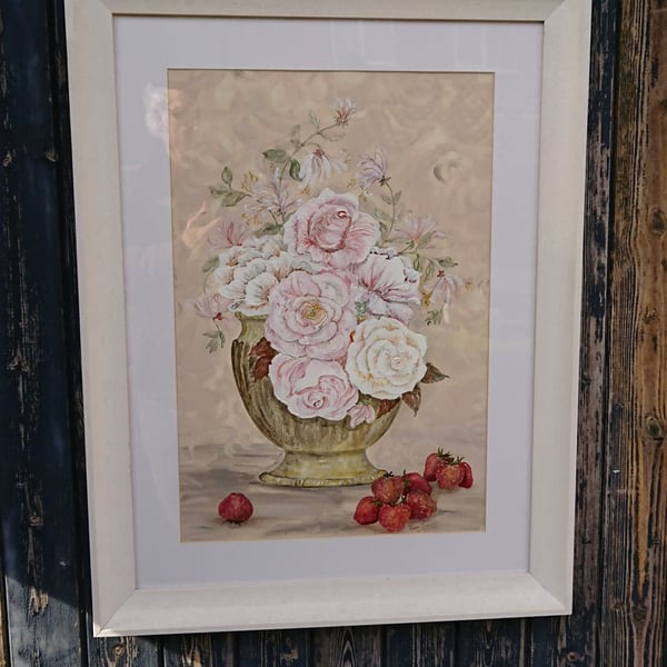 Cabbage roses in pottery bowl with strawberries