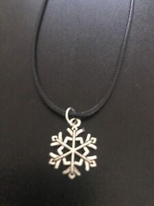 snowflake charm pendant on a 18" leather cord necklace