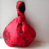 Beautiful red satin Japanese knot bag with floral jacquard