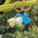 Glass bluebird flower huggie hoops Brass pearlised floral