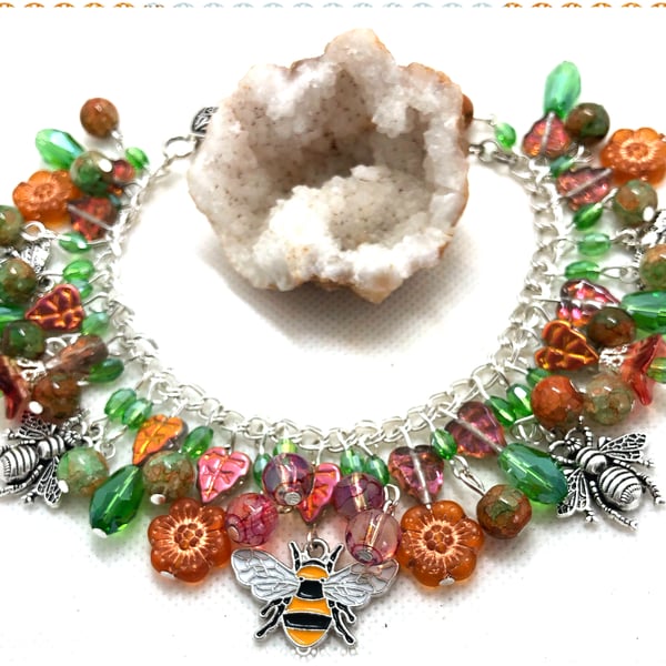 OOAK bee charm bracelet with Czech glass flowers and leaves