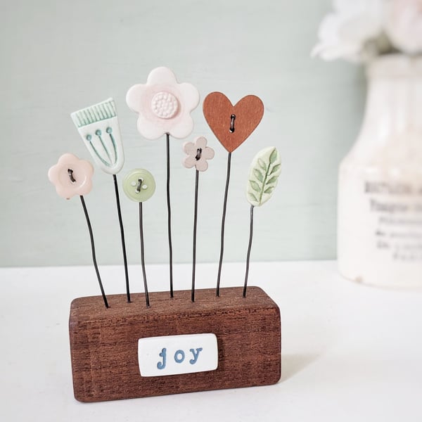 Clay Flowers in a Button Garden Block 'Joy'