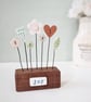 Clay Flowers in a Button Garden Block 'Joy'