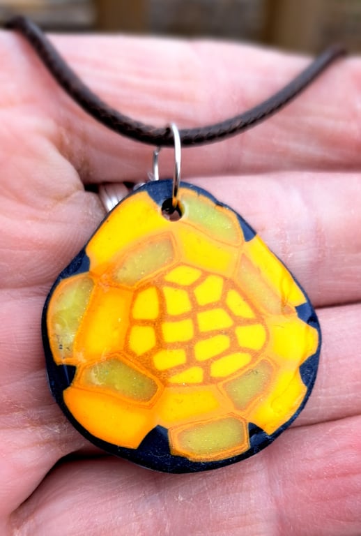 Ovid polymer clay sunflower themed pendant