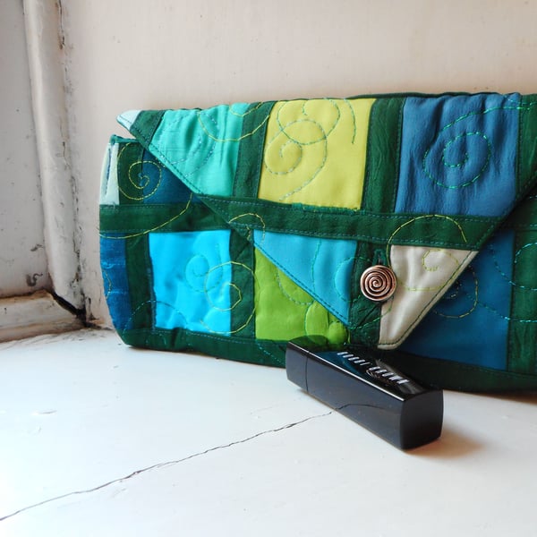 Handmade mixed textile clutch bag with asymmetrical flap