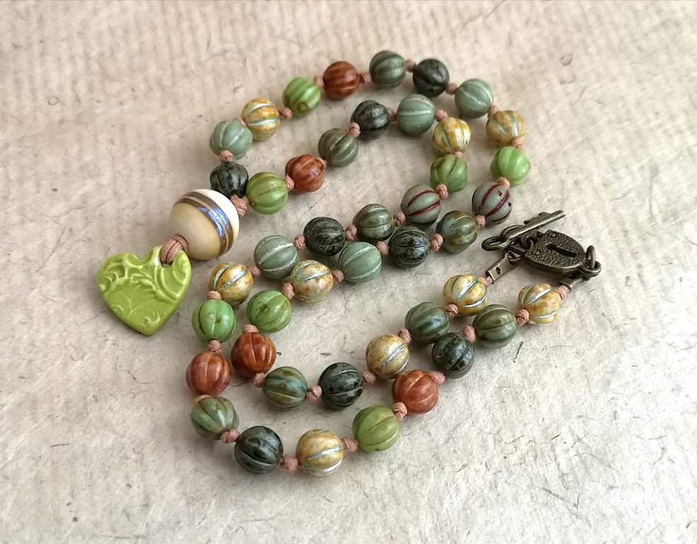 "pumpkin" Czech glass bead knotted cord necklace with green ceramic heart 