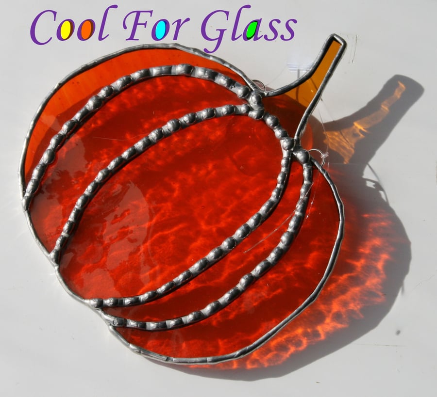 Pumpkin Vibrant orange stained glass hanging pumpkin  with decorative solder.