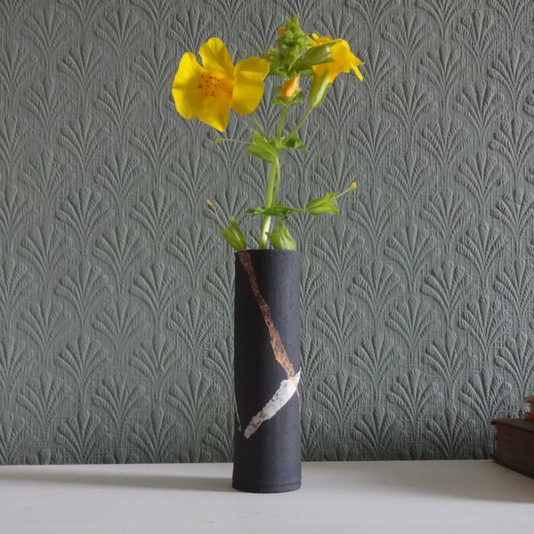 Skinny black ceramic posy or bud vase. Abstract ribbons design in white, yellow.