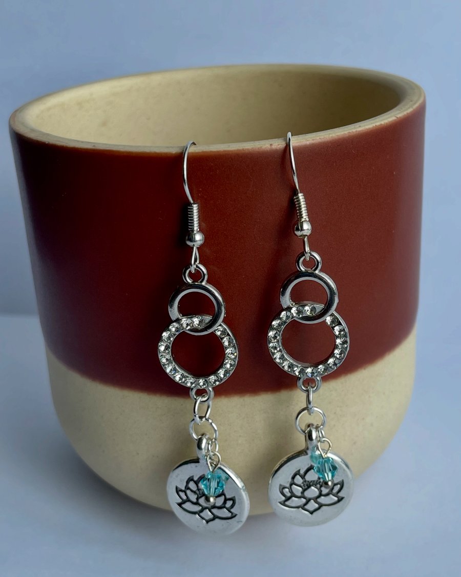 Infinity and Lotus Flower Dangle Earrings with Blue Crystal
