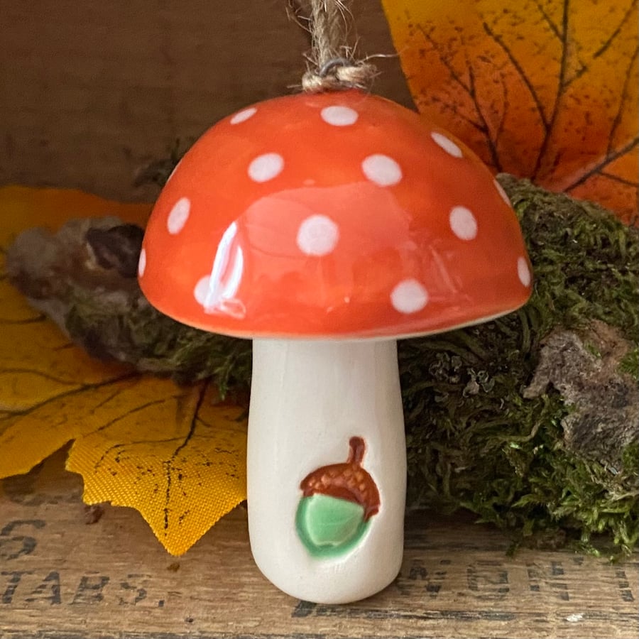 Browny red ceramic toadstool decoration with acorn detail