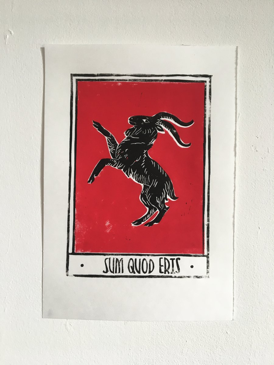 Sum Quod Eris, linocut print black goat with a red background on handmade paper