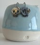 Spooky Silver Skull Earrings for Halloween with a touch of gold - Image 1