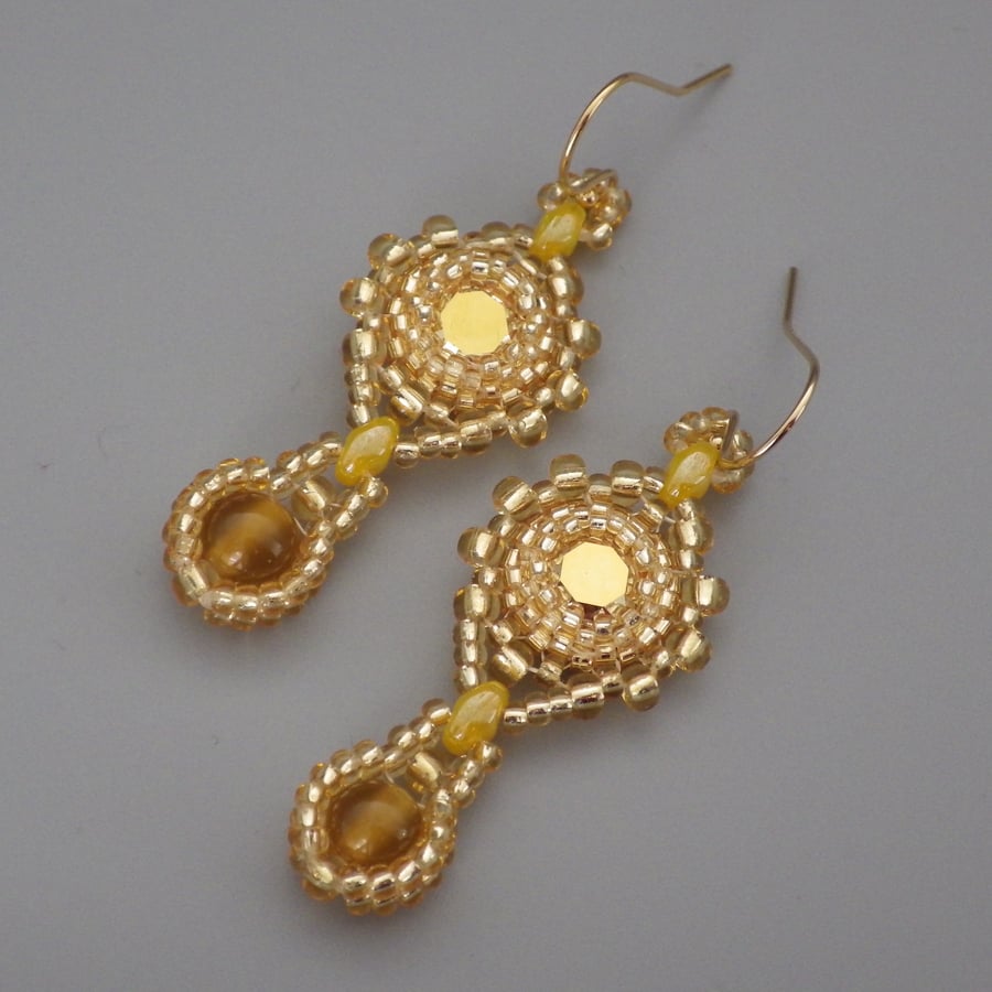 Beadwoven golden Swarovski chaton earrings with yellow carnelian drops