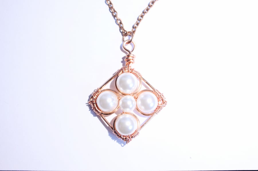 Copper and white crystal pearl cross pendant