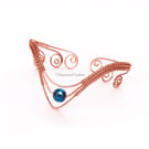 Wire-Wrapped Copper Arm Cuff with Dark Blue Faceted Hematite
