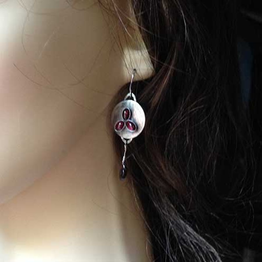 Silver and red dangle shield earrings