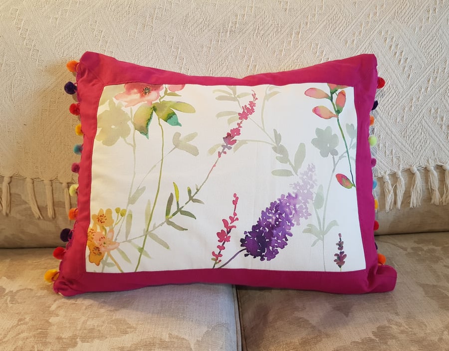 Cushion; floral print, fuchsia pink border & rainbow pompom trim : feather pad