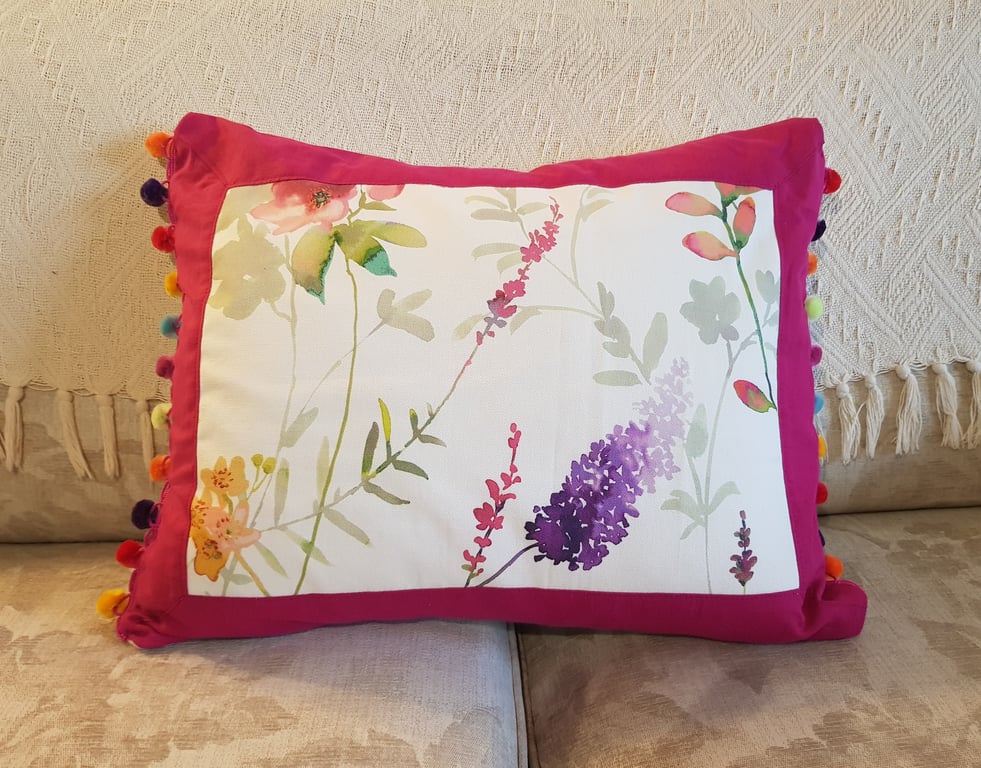 Cushion; floral print, fuchsia pink border & rainbow pompom trim : feather pad
