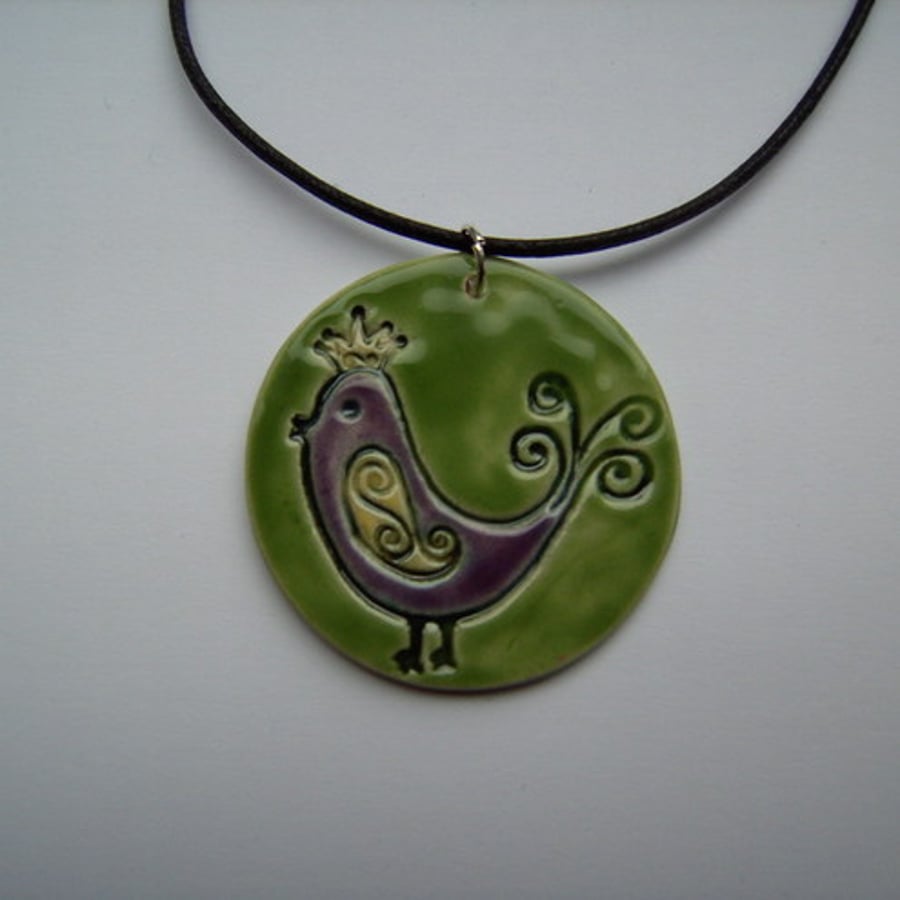 Queen of the exotic birds ceramic pendant