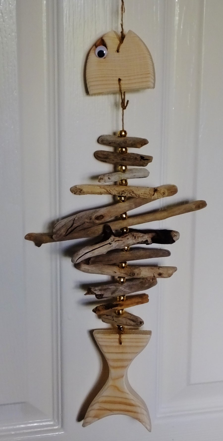 Cornish driftwood fish wallhanging decoration with gold coloured beads
