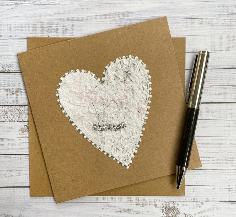 Up-cycled white embroidered heart card. 