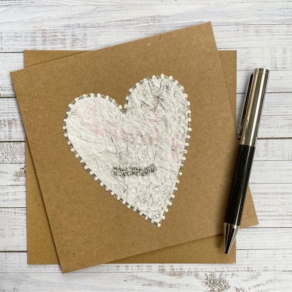 Up-cycled white embroidered heart card. 