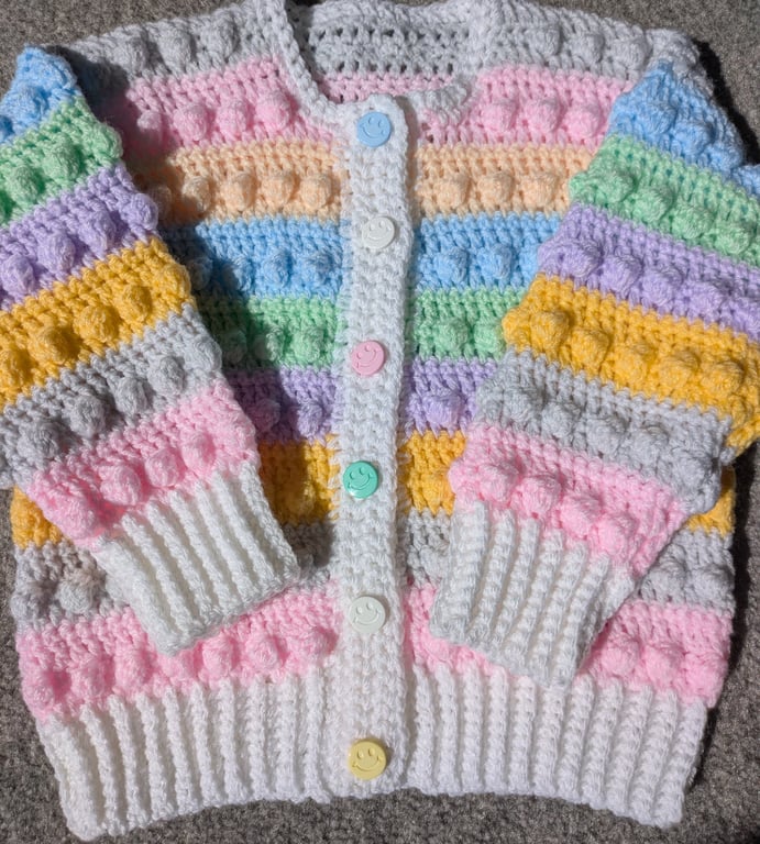 Multi coloured pastel cardigan with smiley face buttons to fit 18 to 24 months 