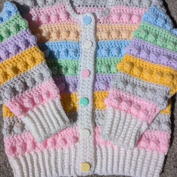 Multi coloured pastel cardigan with smiley face buttons to fit 18 to 24 months 