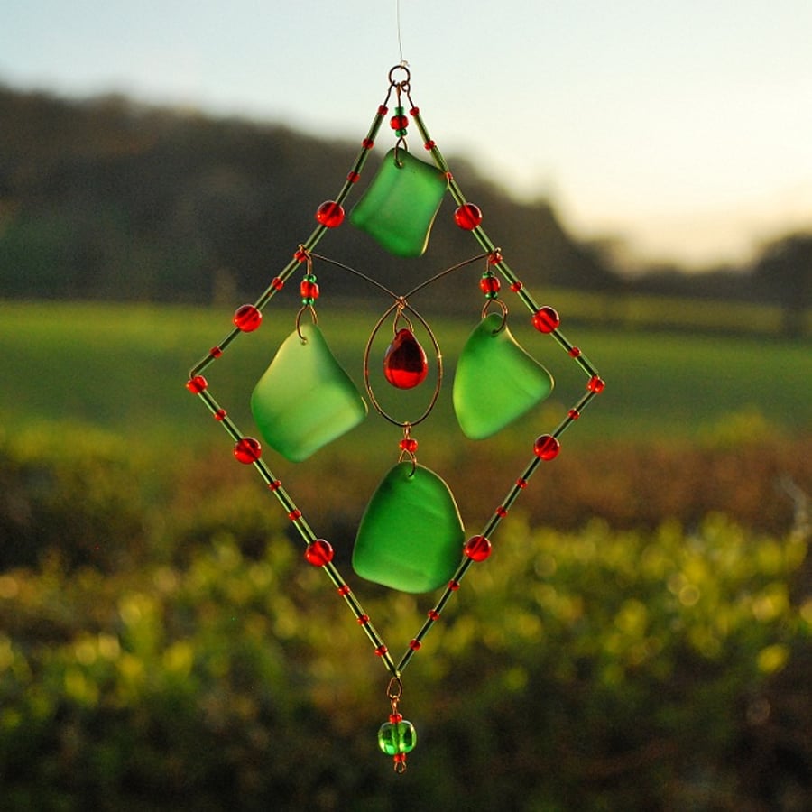 Green beach glass sun catcher with red beads