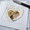 Embroidered up-cycled fabric golden and white heart Art Card.