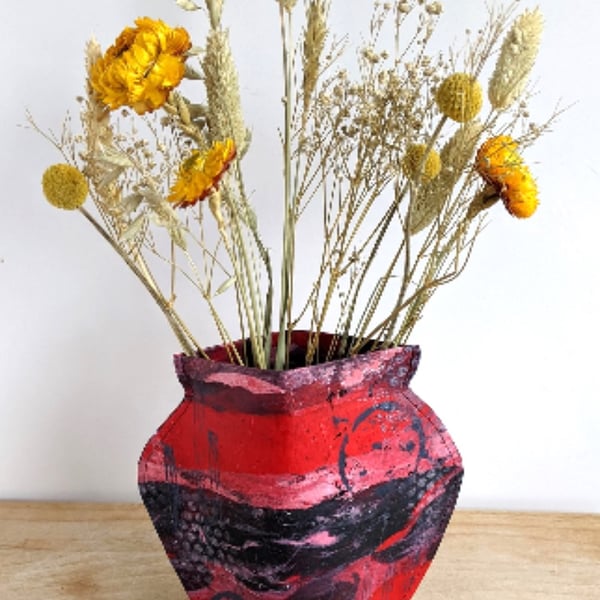 Paper vase cover, deep reds and black abstract design