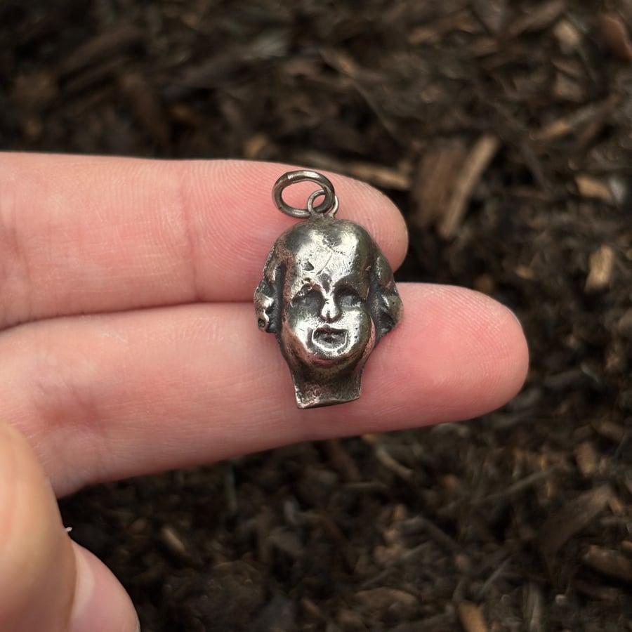 Victorian doll's head pendant