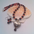 Necklace and Earrings Set with Red and Black Beads and a Brushed Metal Heart