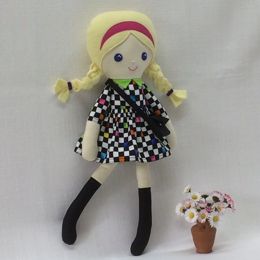 Daisy doll wearing an Op Art dress