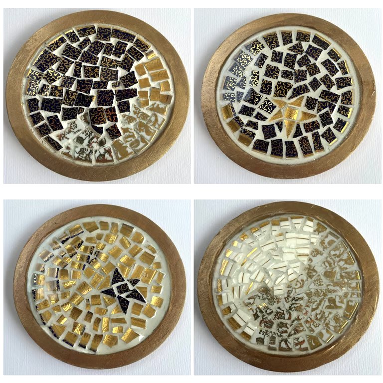 A set of four, resined ceramics wooden coasters with a gold and blue theme. 