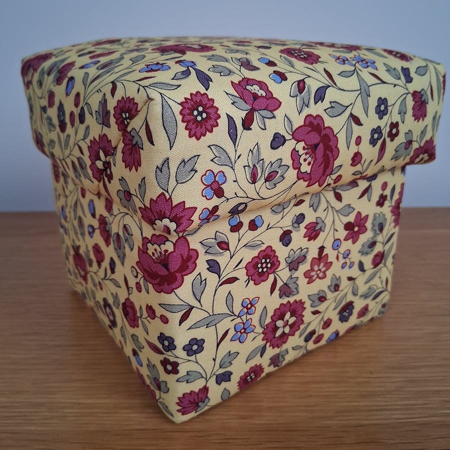 Decorative yellow and burgundy fabric covered box