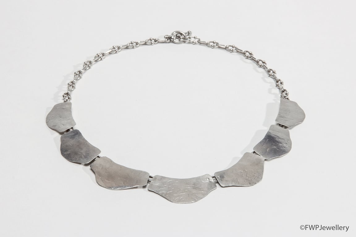 Seven Beaten Silver Units Necklace on Silver Link Chain