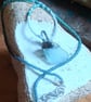 Frosty aqua sea glass, silver and seed-bead swivel necklace pendant.