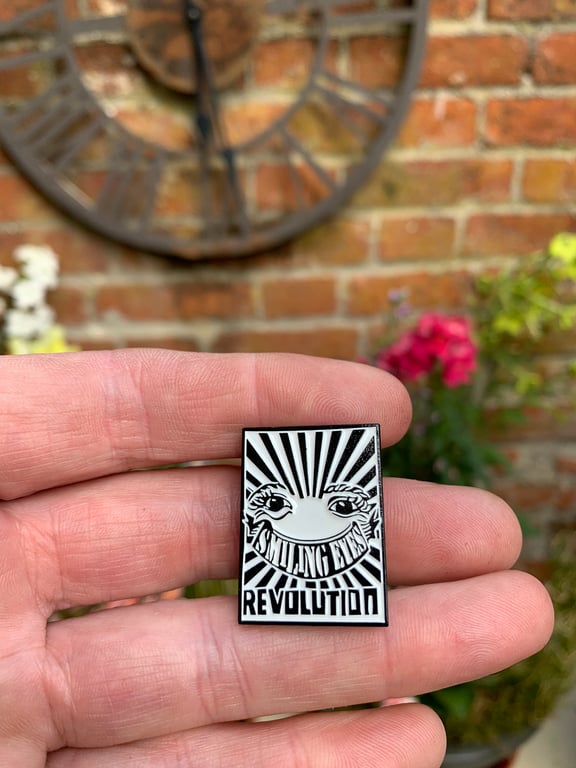 smiling eyes revolution enamel pin