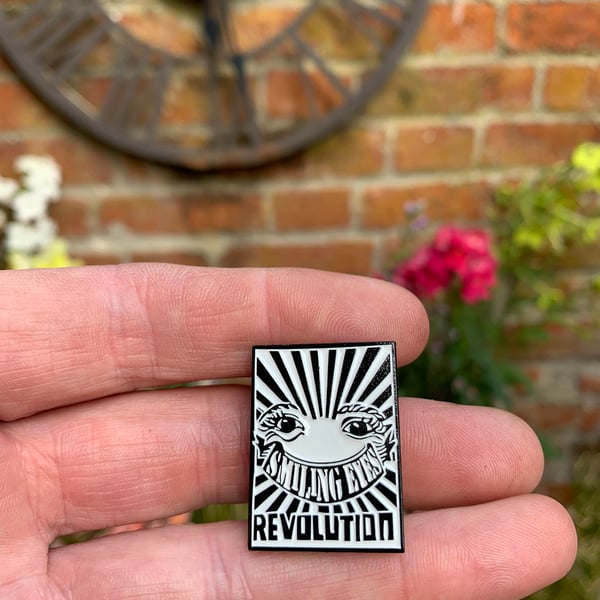 smiling eyes revolution enamel pin