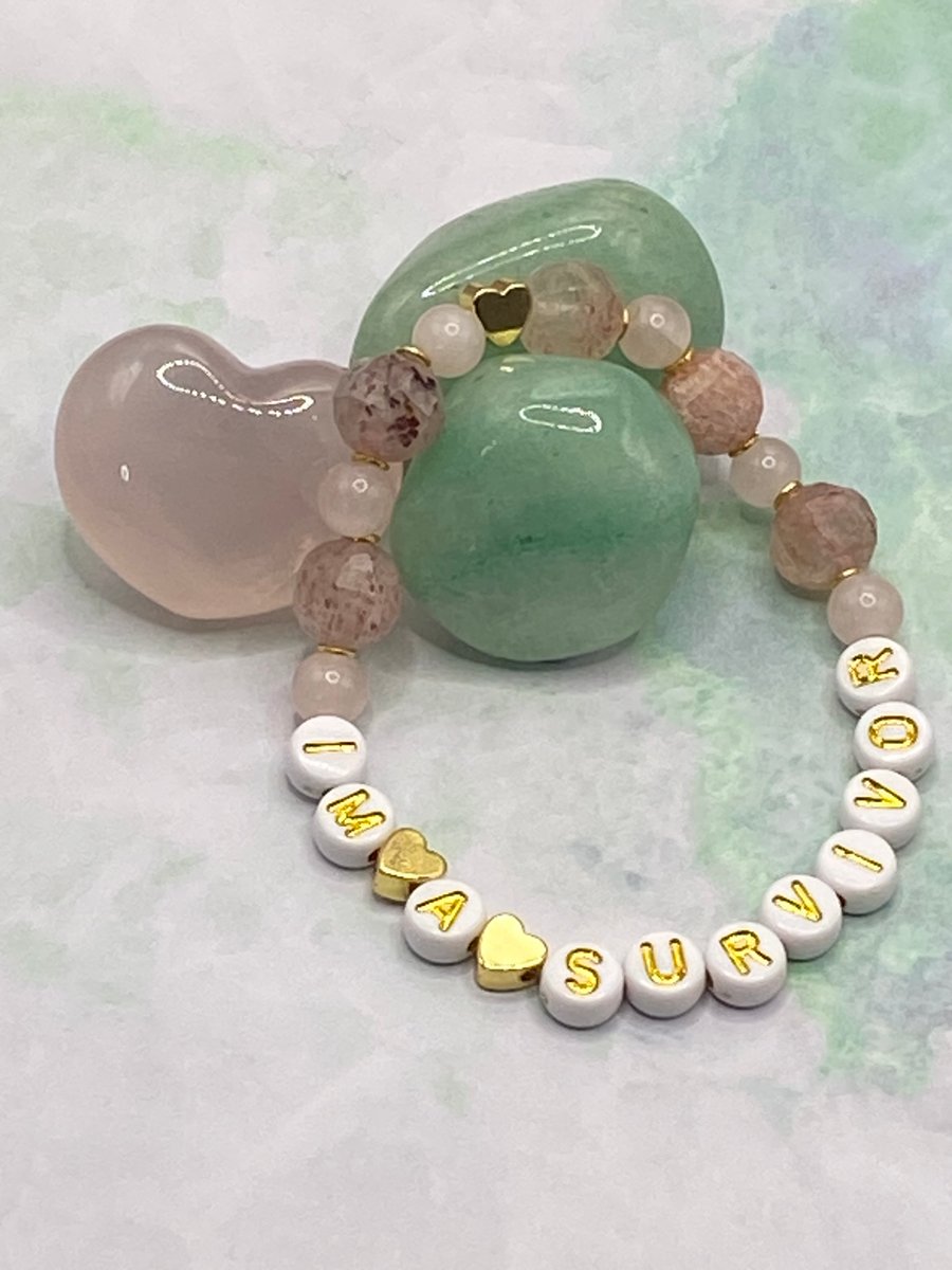 'I'm A Survivor' stretchy bracelet with rose quartz and strawberry quartz stones