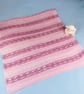 Pink Hand Knitted Baby Blanket with Fair Isle Inspired Stripes - Image 1