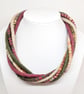 The Wrapped Twist: felted cord necklace in shades of green, stone and mulberry