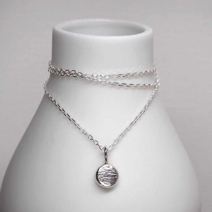 Silver pebble pendant necklace