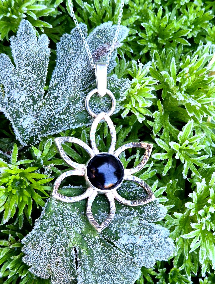 Sterling silver flower pendant with blue goldstone